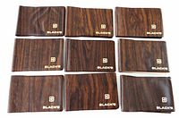 Front view of nine brown Black's mini photo albums with logo visible