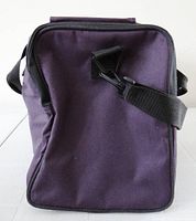 Side view showing purple cloth body, black detachable shoulder strap