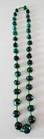Full length view of green stone beaded necklace
