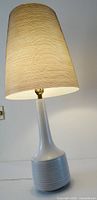 Full view of lamp showing ceramic base and shade