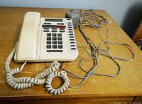 Bell Vista 200 corded phone with handset, cords and power adapter on table