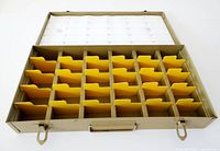 Box open showing yellow dividers and index card
