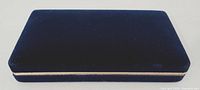 Closed navy blue velvet jewellery box exterior