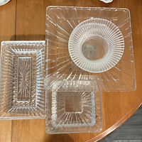 Grouping of clear glass square, rectangular, and round pieces