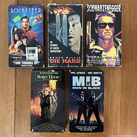 Front covers of all five VHS cases