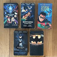 Front view of all five VHS tapes showing cover art and titles