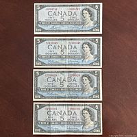 All four 1954 $5 banknotes laid out together