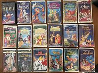 Front covers of all 18 Disney VHS tapes laid out in rows