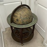 Closed globe bar on stand, full view