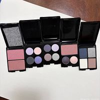 All five open Lancome compacts side by side