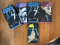 Front covers of all four VHS tapes, two copies of Star Wars shown
