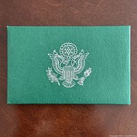 Front of textured green envelope with Great Seal