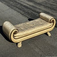 Full view of bench from side angle on pavement