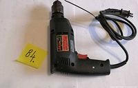 Full view of Skil corded drill with power cord