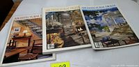 Three Architectural Digest magazines laid out