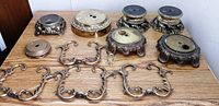 All lamp bases, arms and hardware laid out on tabletop