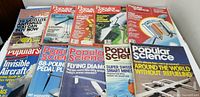 Ten Popular Science issues from 1980-1987 laid out showing covers and mastheads