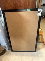 Front view of framed cork bulletin board