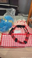 All three items together: shemagh, necklace, hip wrap in packaging