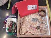 Group shot of entire lot in tray, showing jewellery, bangles, pouches and makeup bag
