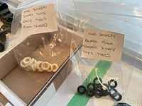 Bag with twelve white treaded Dinky Toys 15mm tires