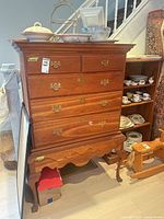 Front view of wood dresser with drawers and pulls