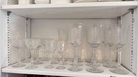 Shelf containing full set of stemware