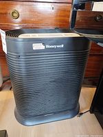 Front view of Honeywell air purifier showing ribbed housing and logo
