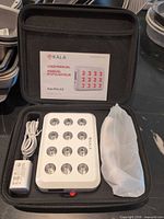 Full kit in carrying case: therapy panel, adapter, manual, protective sleeve