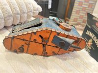 Side view underside showing lithographed panel lines, STOP/START lever, key slot