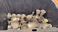 Bin containing numerous pewter pieces