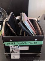 Box holding multiple silver-plated frames