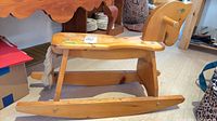 Full side view of wooden rocking horse