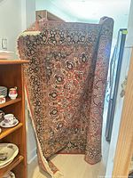 Full view of rug draped, showing overall size and pattern
