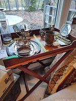 Full view of tray table with folding base and contents shown for scale