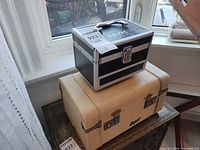 Both NYX and Capri cases stacked showing scale and exterior