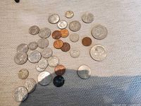 Group shot of all coins spread on fabric