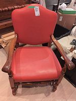 front view of leather upholstered armchair