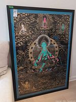 Full framed thangka leaning against wall