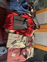 Overview of multiple new shirts laid out on table, various colours and packs visible