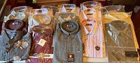 Overview of 17 packaged shirts in three rows