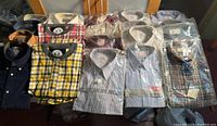Full lot view showing all packaged shirts and pajama tops