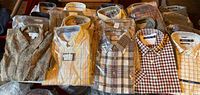 Overview of multiple packaged shirts laid out