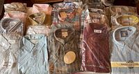 Table view of 20 packaged shirts showing colour and brand variety