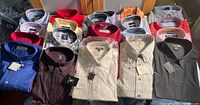 Group of folded men’s shirts in various colours and patterns