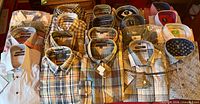 Overview of 20 new men’s shirts laid out, some packaged