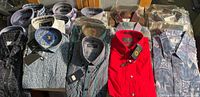 Front view showing multiple new shirts, tags visible