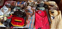 Overview of 20 folded and packaged shirts on table