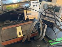 All four devices grouped: GE clock radio, RCA clock radio, Yorx clock radio, Fanon intercom with adapter
