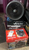 Assembled NOMA fan on NOMA and Honeywell boxes showing all three items
